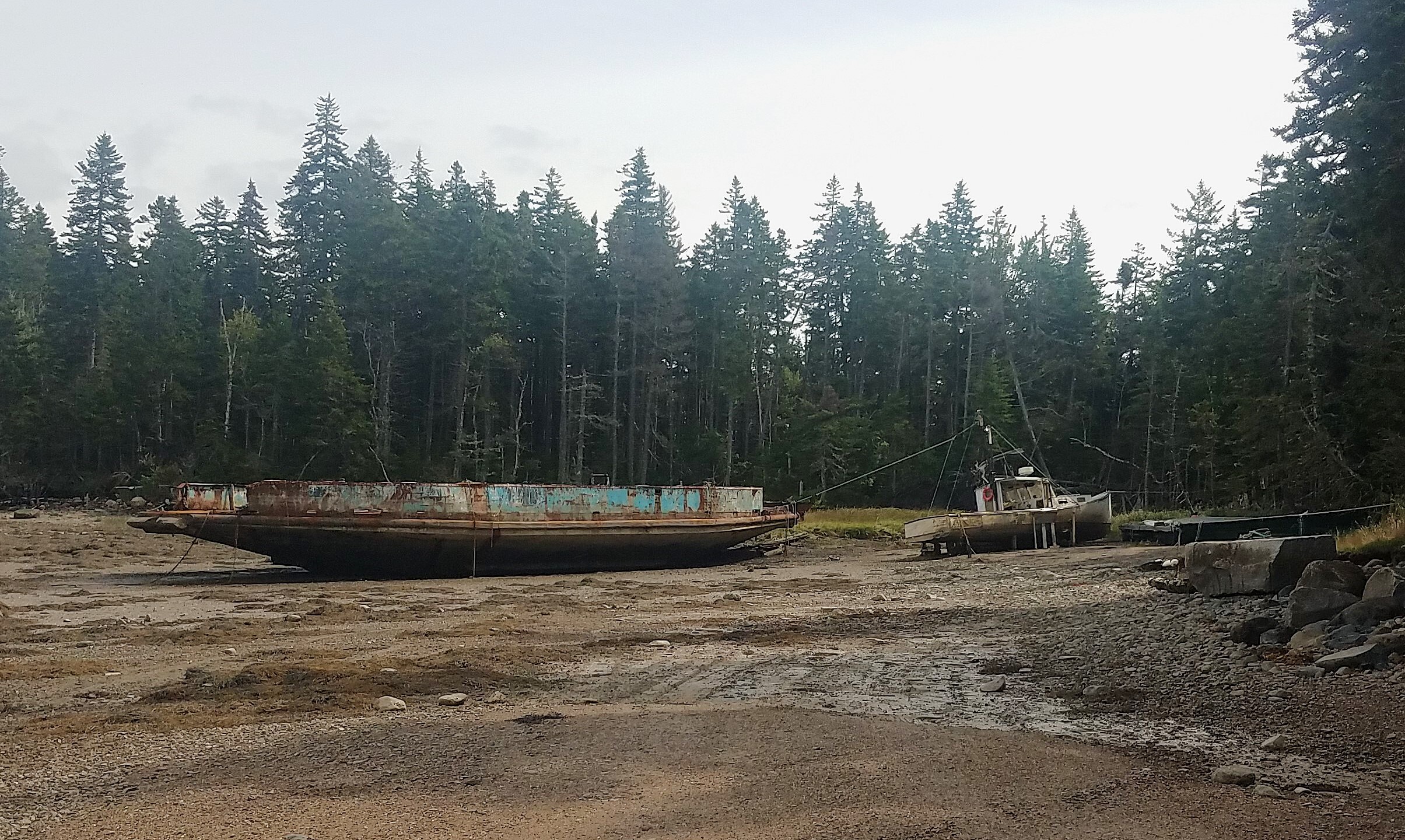 This hidden cove adjacent to Roque Bluffs State Park, Maine, which has been used as a local dumping ground for end-of-life commercial vessels for years, will have ADVs removed as part of a groundbreaking removal program. (credit: John Noll, State of ME)